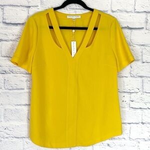 Trina Turk yellow cutout v neck short sleeve top medium NWT